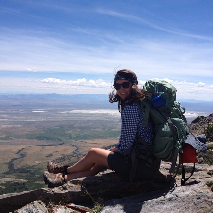 Girl sitting on mountain